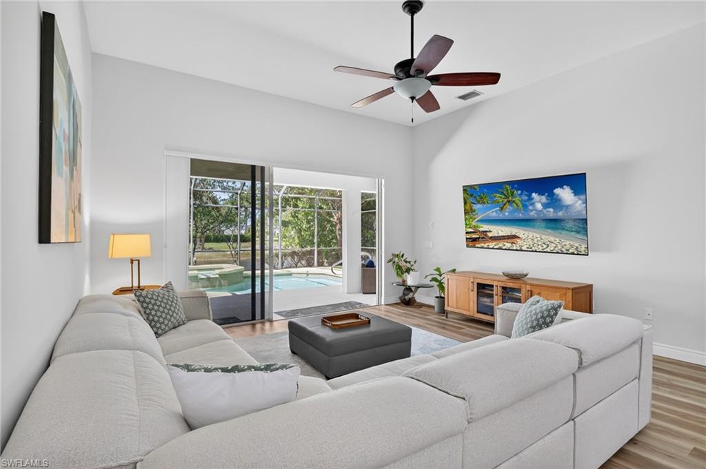 2065 Mandarin Lane Naples, FL 34120 - Photo 8 of 46 a living room with furniture and a large window
