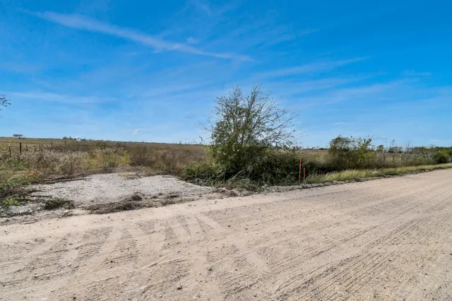 a view of a road with a yard