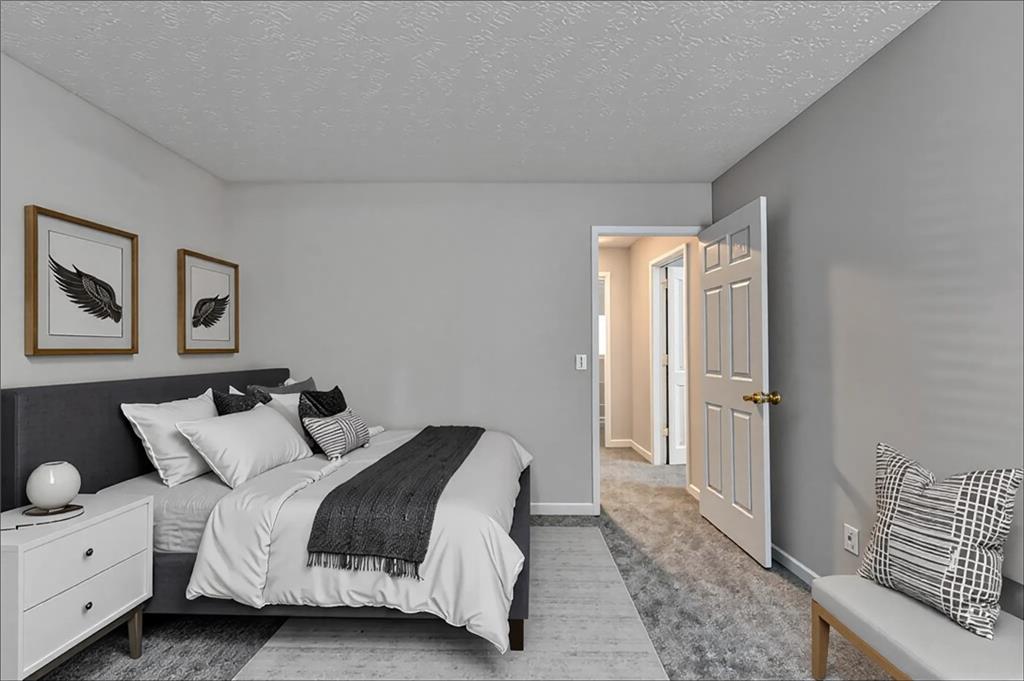 2748 Farmstead Court Grayson, GA 30017 - Photo 15 of 83 a bedroom with a bed and painting on the wall