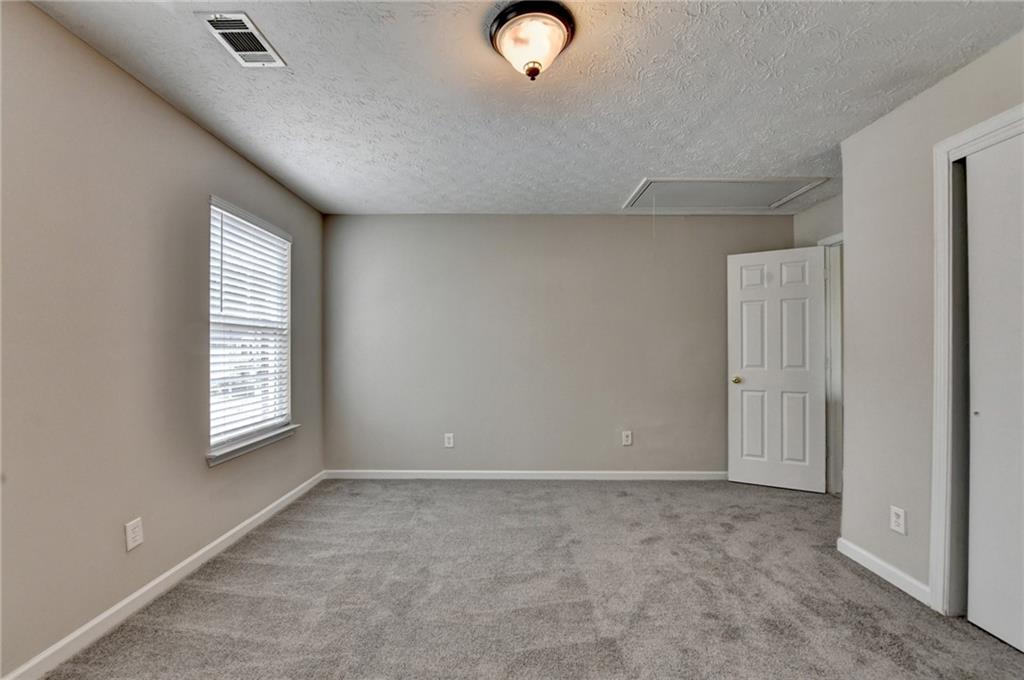 2748 Farmstead Court Grayson, GA 30017 - Photo 36 of 83 a view of an empty room with a window
