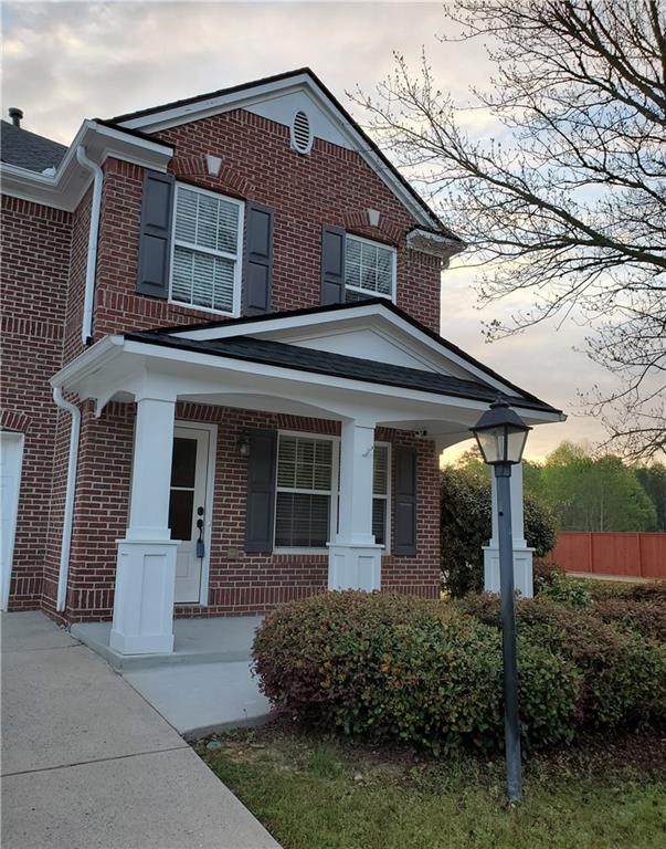 2748 Farmstead Court Grayson, GA 30017 - Photo 4 of 83 front view of a house with a small yard