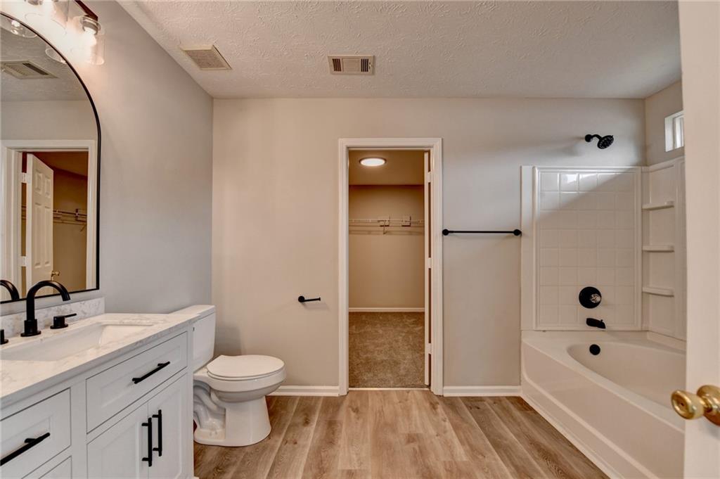 2748 Farmstead Court Grayson, GA 30017 - Photo 42 of 83 a bathroom with a sink a toilet and shower