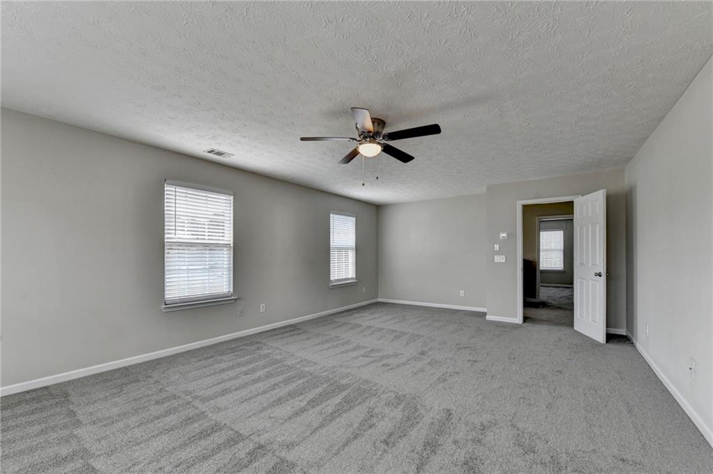 2748 Farmstead Court Grayson, GA 30017 - Photo 51 of 83 a view of a livingroom with a ceiling fan and window