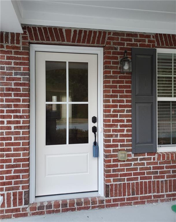 2748 Farmstead Court Grayson, GA 30017 - Photo 6 of 83 a view of a brick building with a window