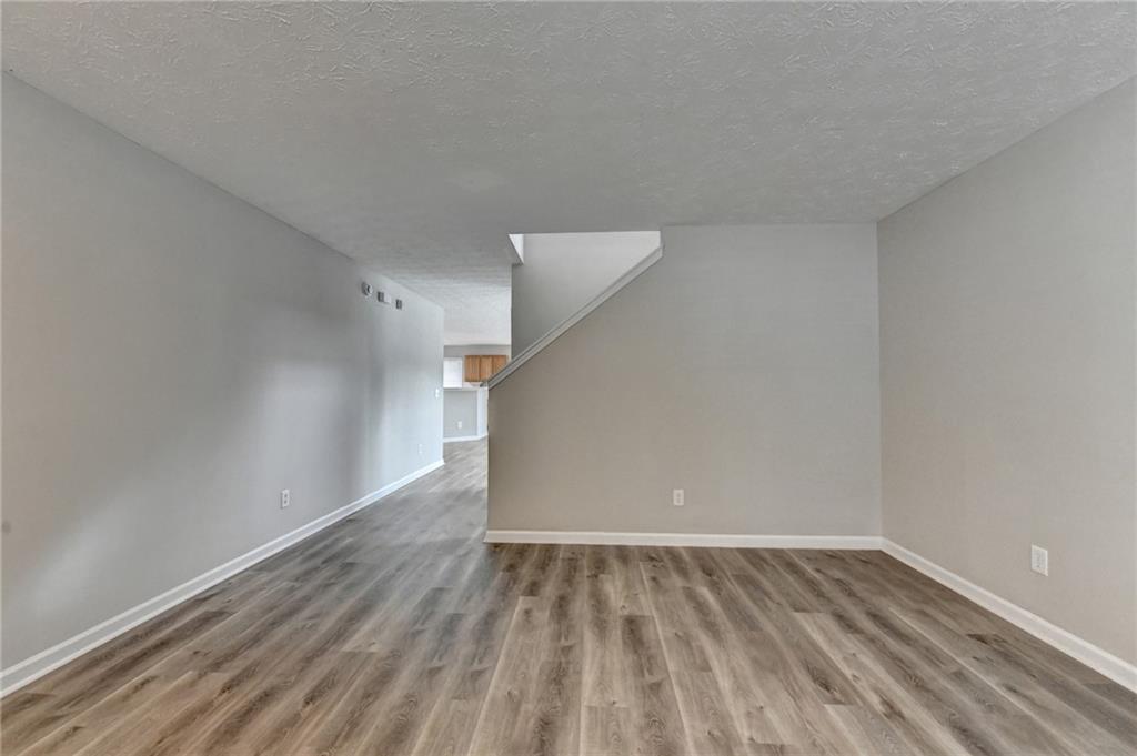 2748 Farmstead Court Grayson, GA 30017 - Photo 61 of 83 a view of an empty room with wooden floor