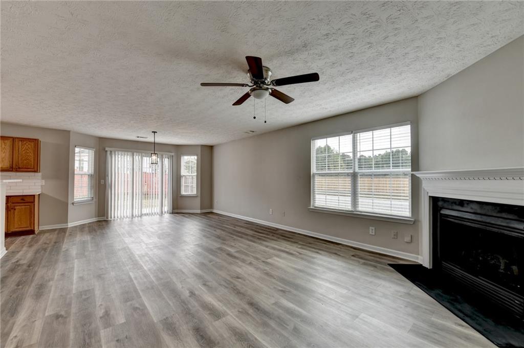 2748 Farmstead Court Grayson, GA 30017 - Photo 64 of 83 a view of an empty room with a fireplace and a window