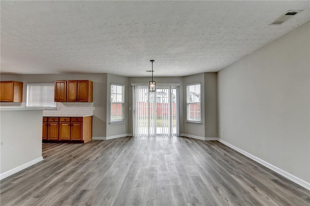 2748 Farmstead Court Grayson, GA 30017 - Photo 70 of 83 wooden floor in an empty room with a window