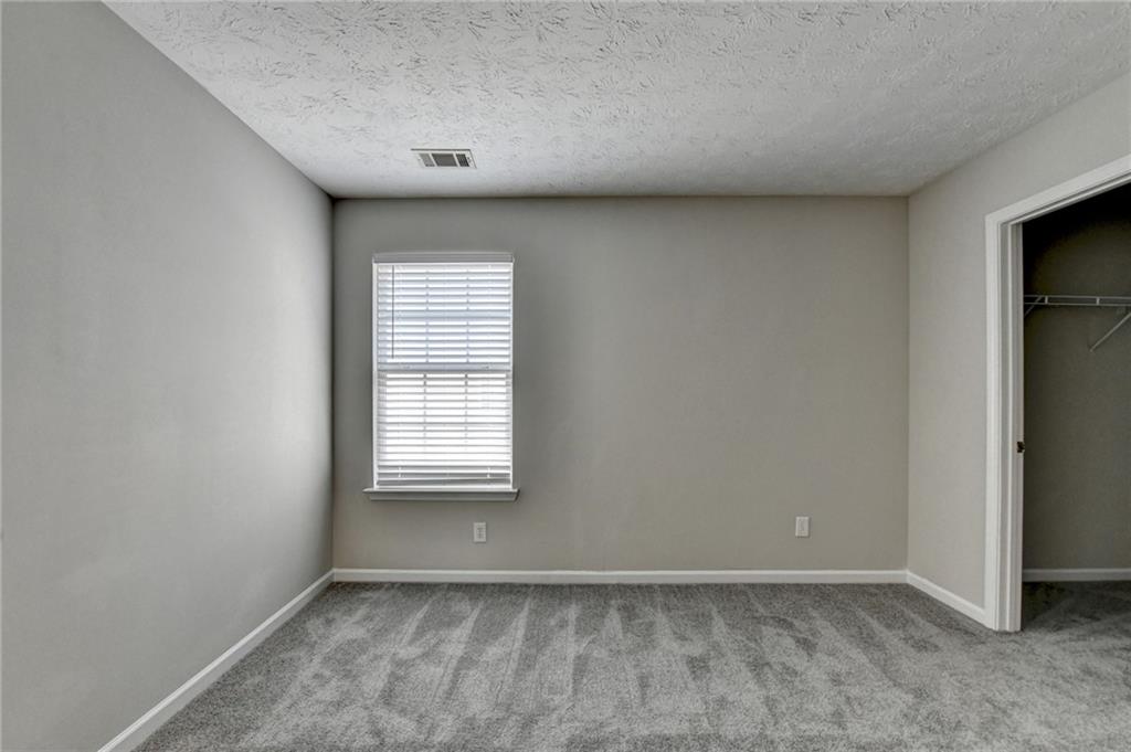 2748 Farmstead Court Grayson, GA 30017 - Photo 75 of 83 an empty room with windows