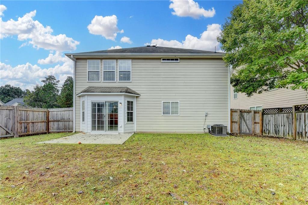 2748 Farmstead Court Grayson, GA 30017 - Photo 80 of 83 a view of a house with a yard and a large tree