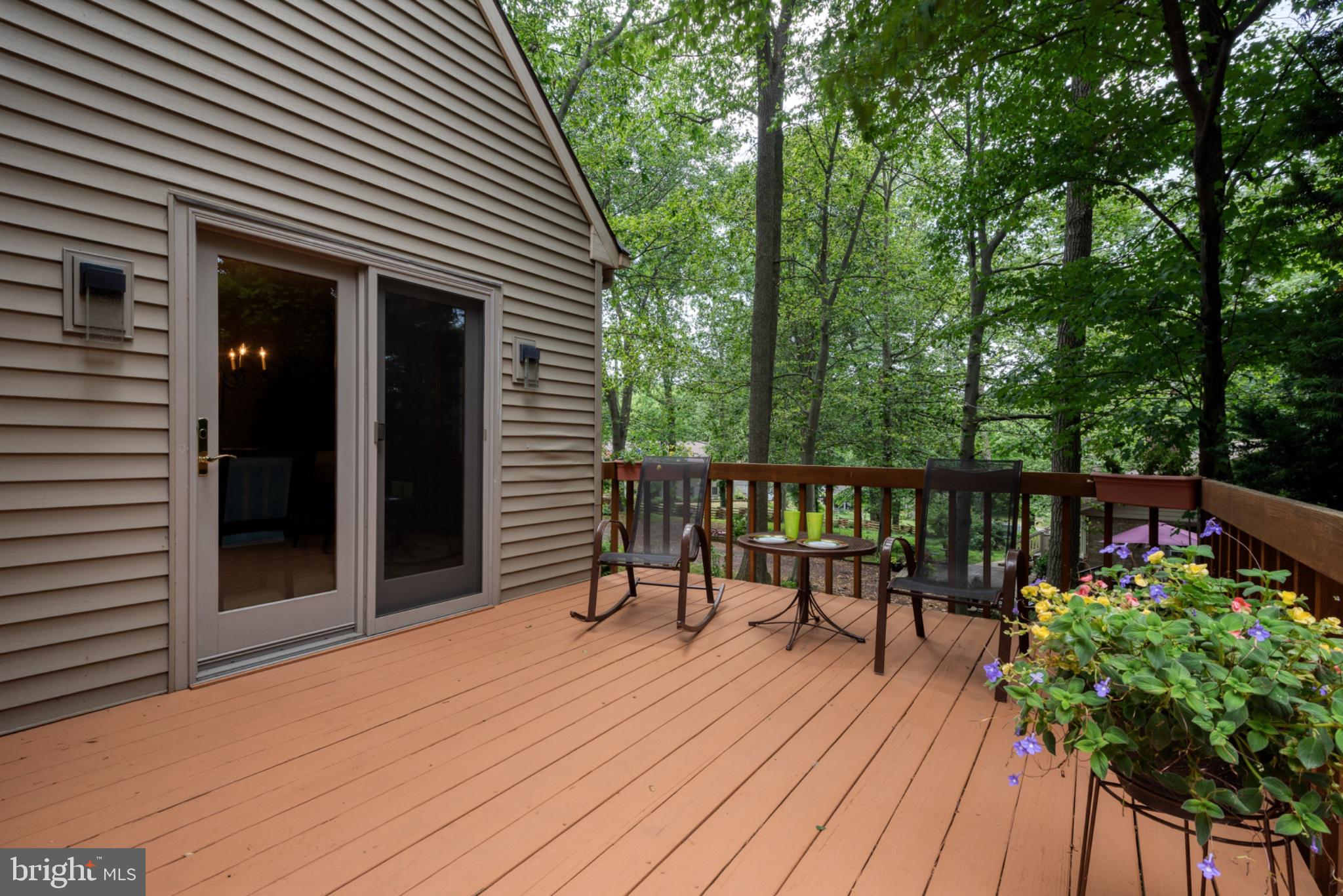 2861 Spring Valley Road Lancaster, PA 17601 - Photo 36 of 59 Serene deck nestled in lush greenery.