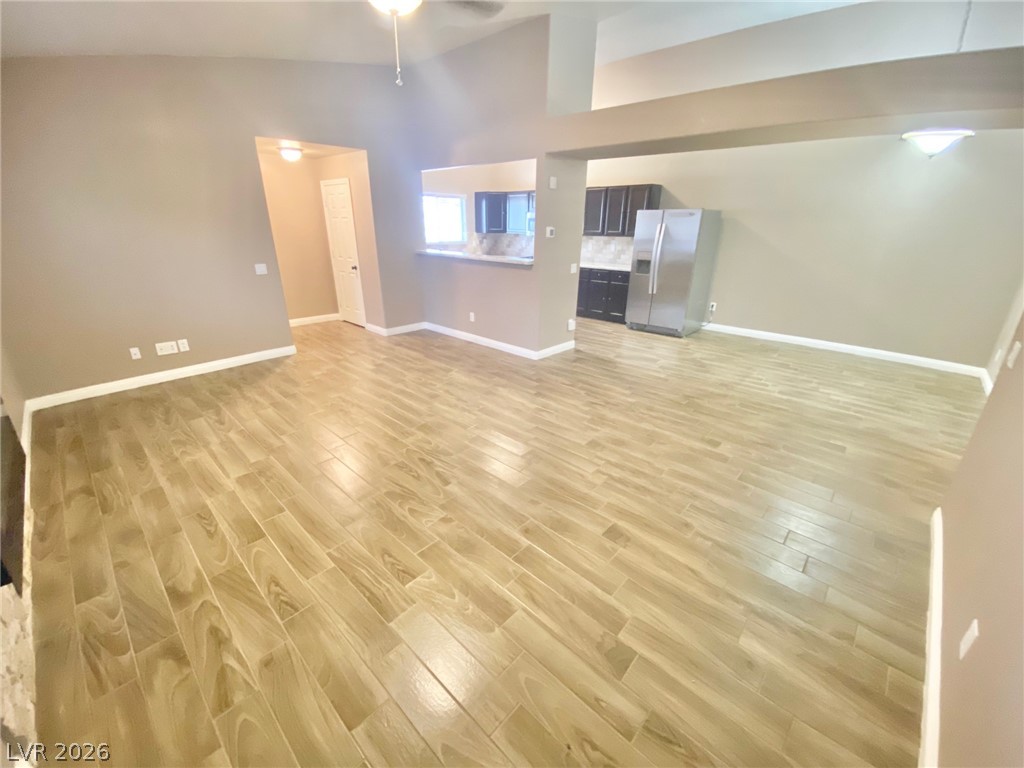2000 Turquoise Ridge Street, Unit 204 Las Vegas, NV 89117 - Photo 29 of 29 An open floorplan seamlessly connects the living area to a modern kitchen, featuring sleek appliances and ample counter space.