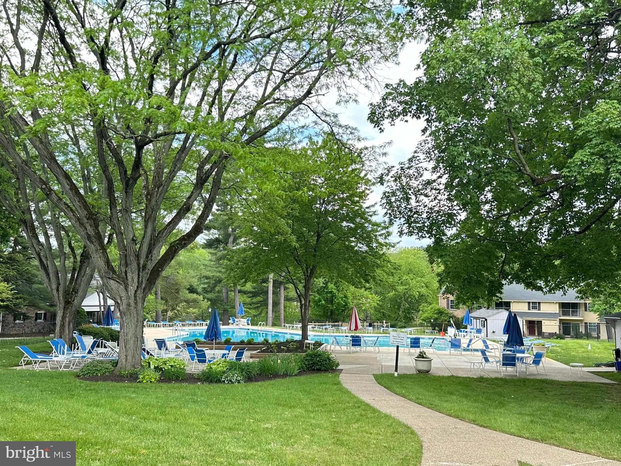 371 Old Forge Crossing, Unit 371 Devon, PA 19333 - Photo 10 of 10 a view of a house with a big yard and large trees