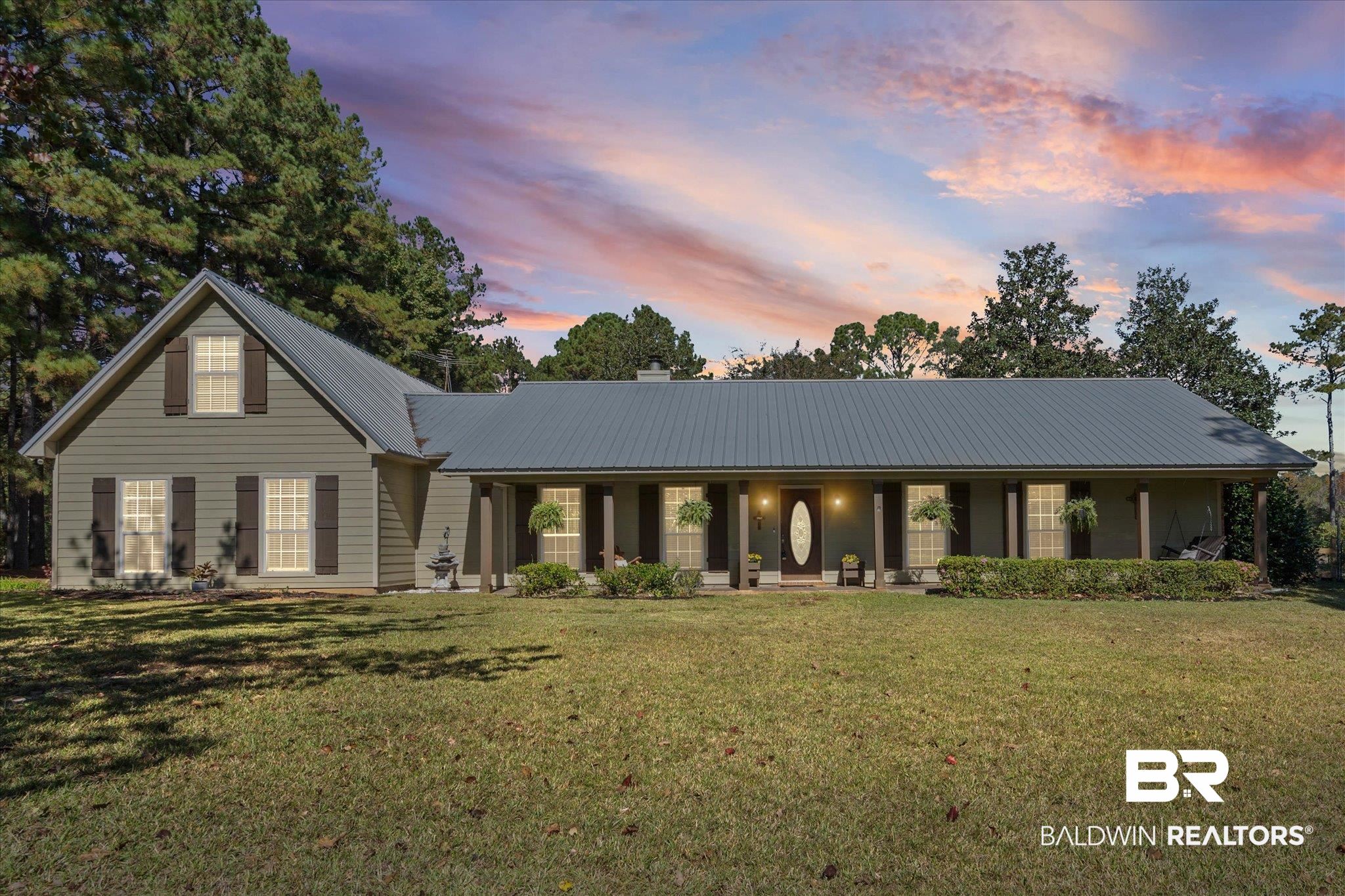 180 Creax Road Axis, AL 36505 - Photo 1 of 35 View of front of property with a metal roof, covered porch, a lawn, and a chimney
