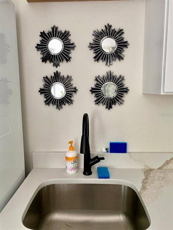 415 Mapleway, Unit A Safety Harbor, FL 34695 - Photo 12 of 50 a bathroom sink with a potted plant