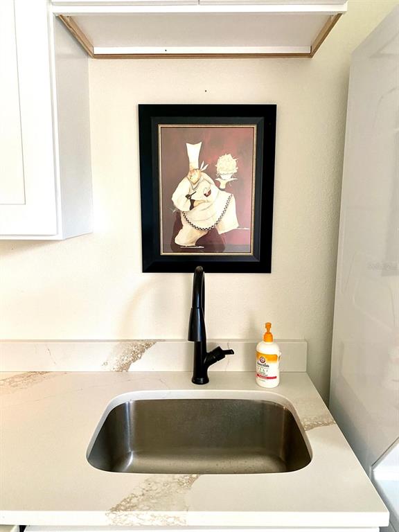 415 Mapleway, Unit A Safety Harbor, FL 34695 - Photo 14 of 50 a bathroom with a sink and a mirror