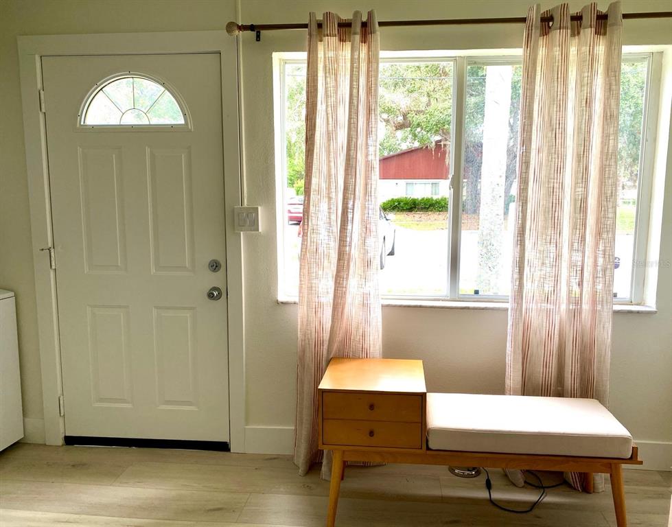 415 Mapleway, Unit A Safety Harbor, FL 34695 - Photo 16 of 50 a room with furniture and window