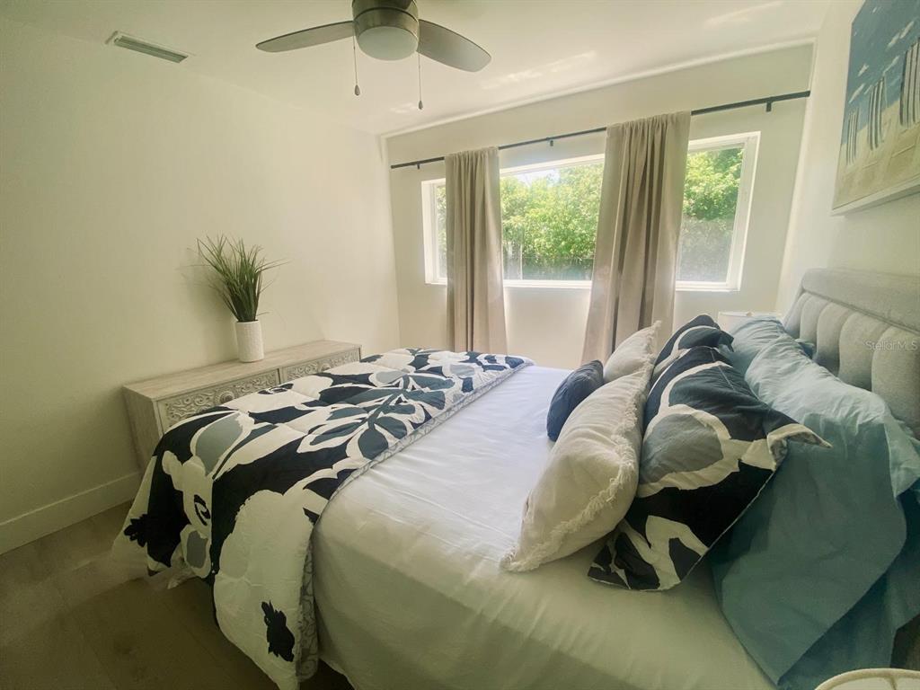 415 Mapleway, Unit A Safety Harbor, FL 34695 - Photo 26 of 50 a bed sitting in a bedroom next to a window