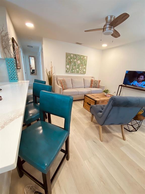 415 Mapleway, Unit A Safety Harbor, FL 34695 - Photo 31 of 50 a living room with furniture and a table