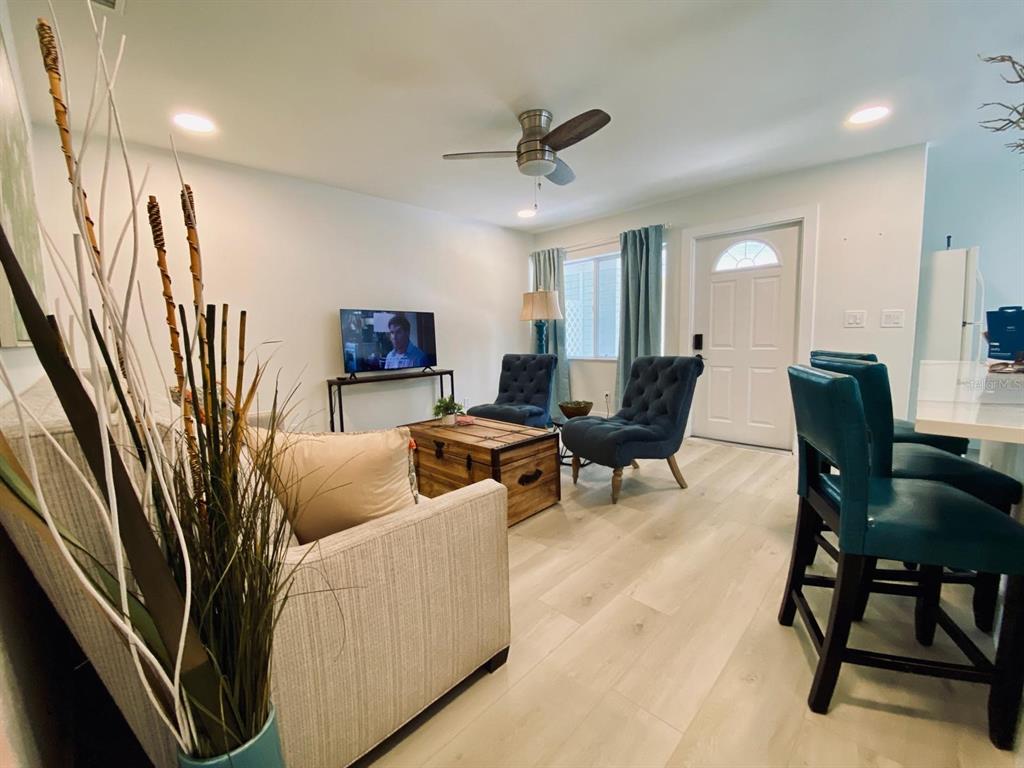415 Mapleway, Unit A Safety Harbor, FL 34695 - Photo 32 of 50 a living room with furniture and a large window