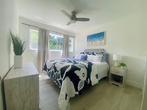 a bedroom with a bed and window