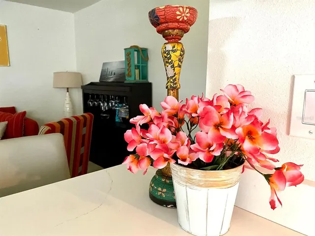 a vase of flowers sitting on a table