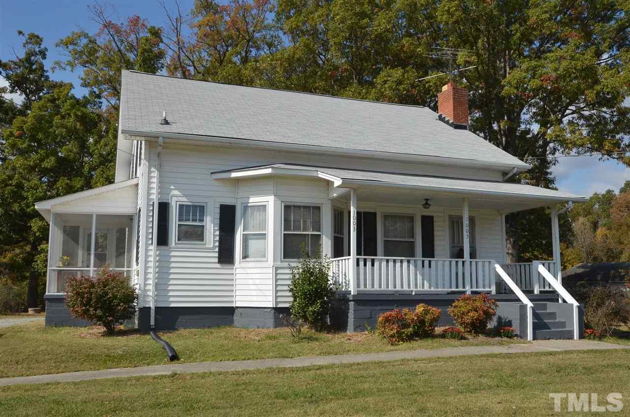 1003 Junction Road Durham, NC 27704 - Photo 1 of 19 a front view of a house with a yard