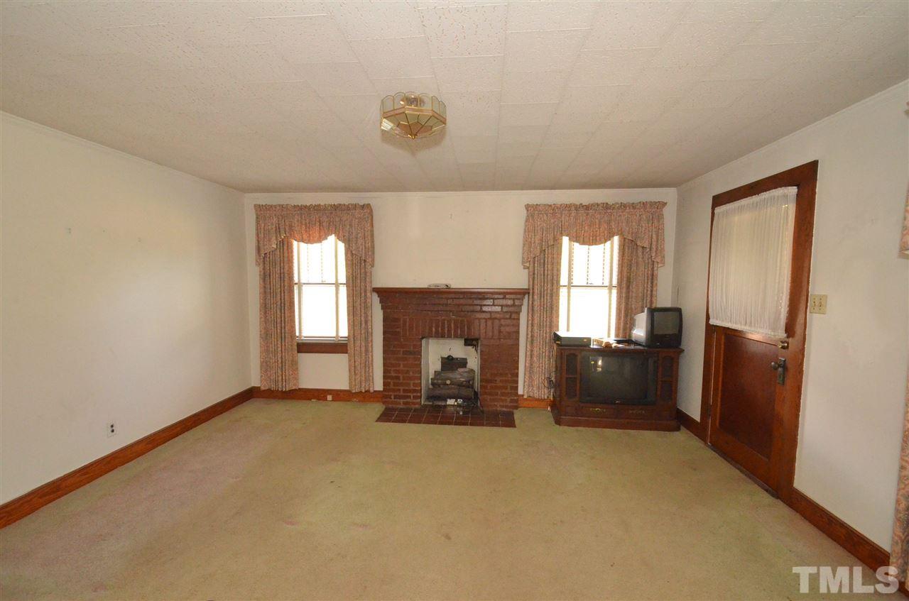1003 Junction Road Durham, NC 27704 - Photo 2 of 19 a view of a livingroom with a fireplace