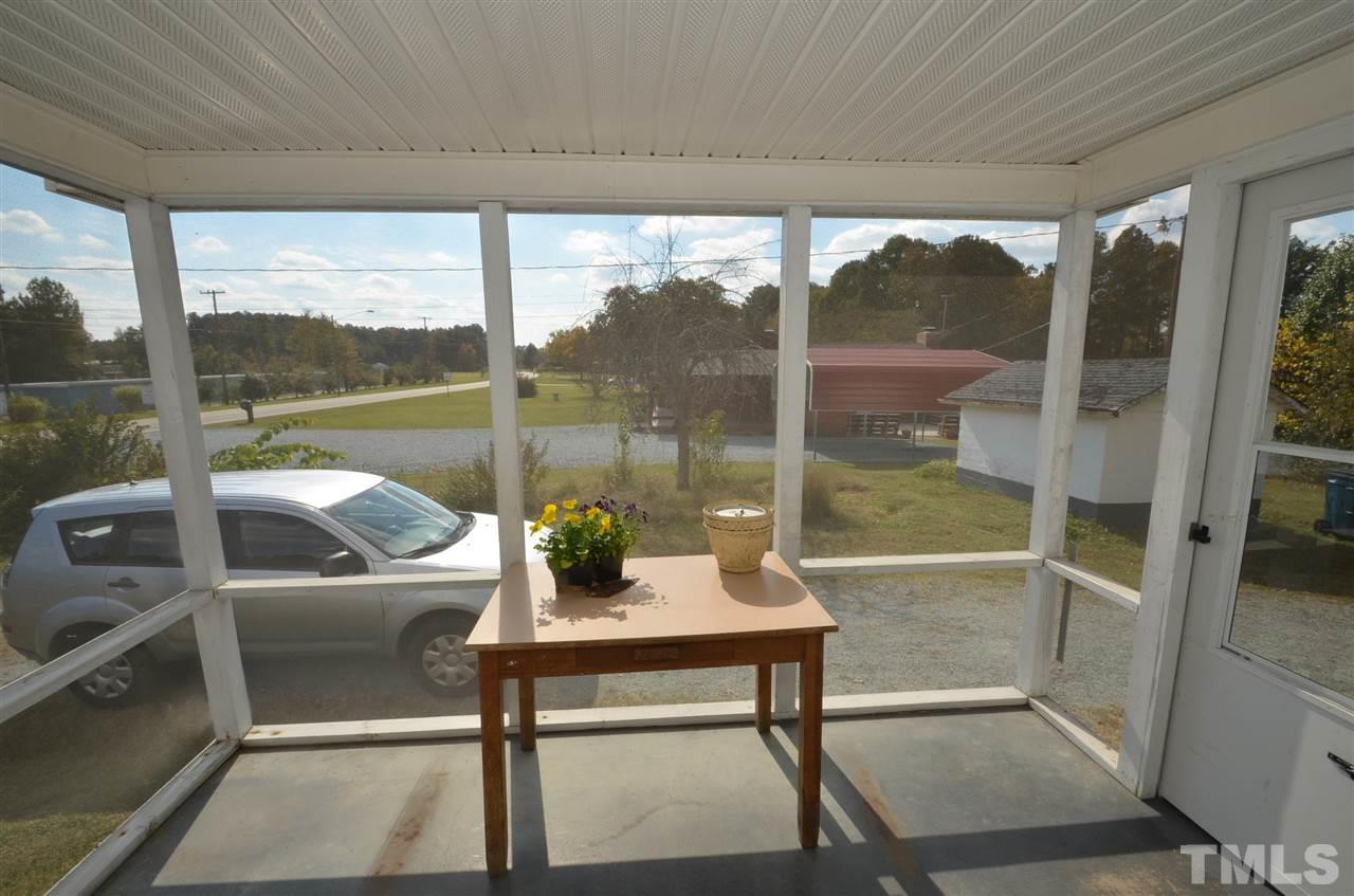 1003 Junction Road Durham, NC 27704 - Photo 11 of 19 a view of a porch with furniture and front door