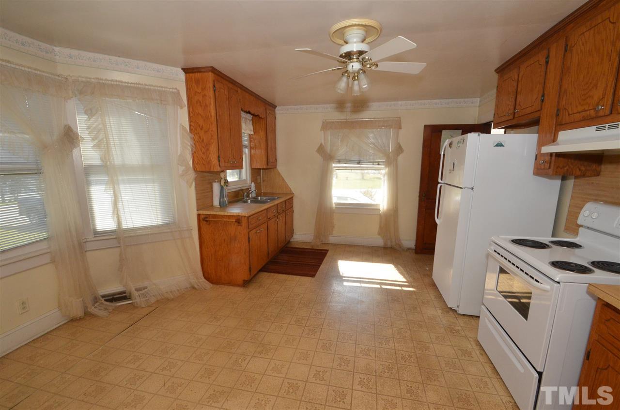 1003 Junction Road Durham, NC 27704 - Photo 3 of 19 a view of a kitchen with fridge and windows
