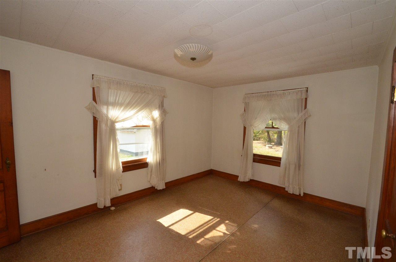 1003 Junction Road Durham, NC 27704 - Photo 6 of 19 an empty room with windows