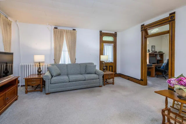 a room with furniture and a flat screen tv