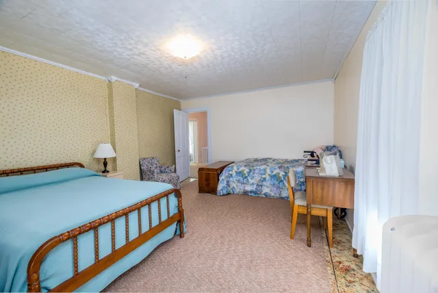 a view of a porch with a floor to ceiling window