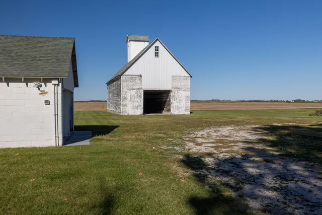 a picture of a wall with a white wall and a white refrigerator