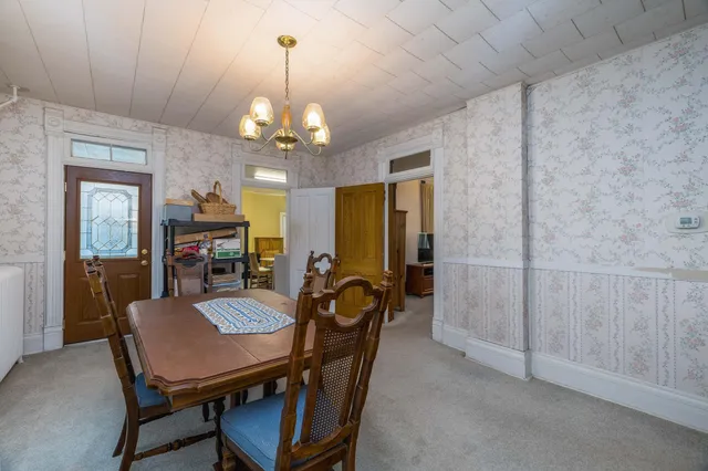 a bedroom with a bed and a potted plant