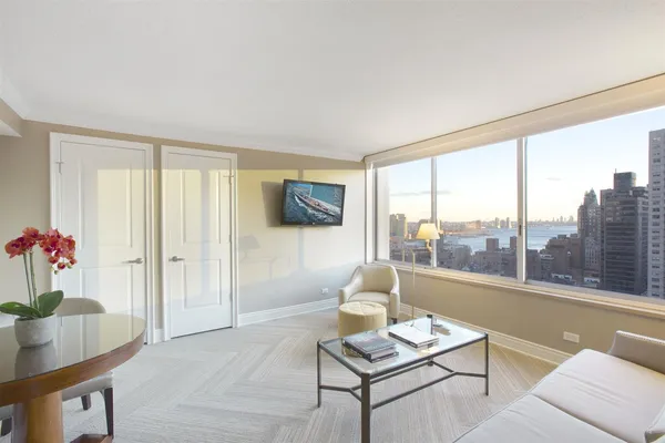 a living room with furniture and a window