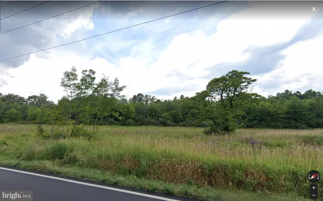 a view of lake with green space