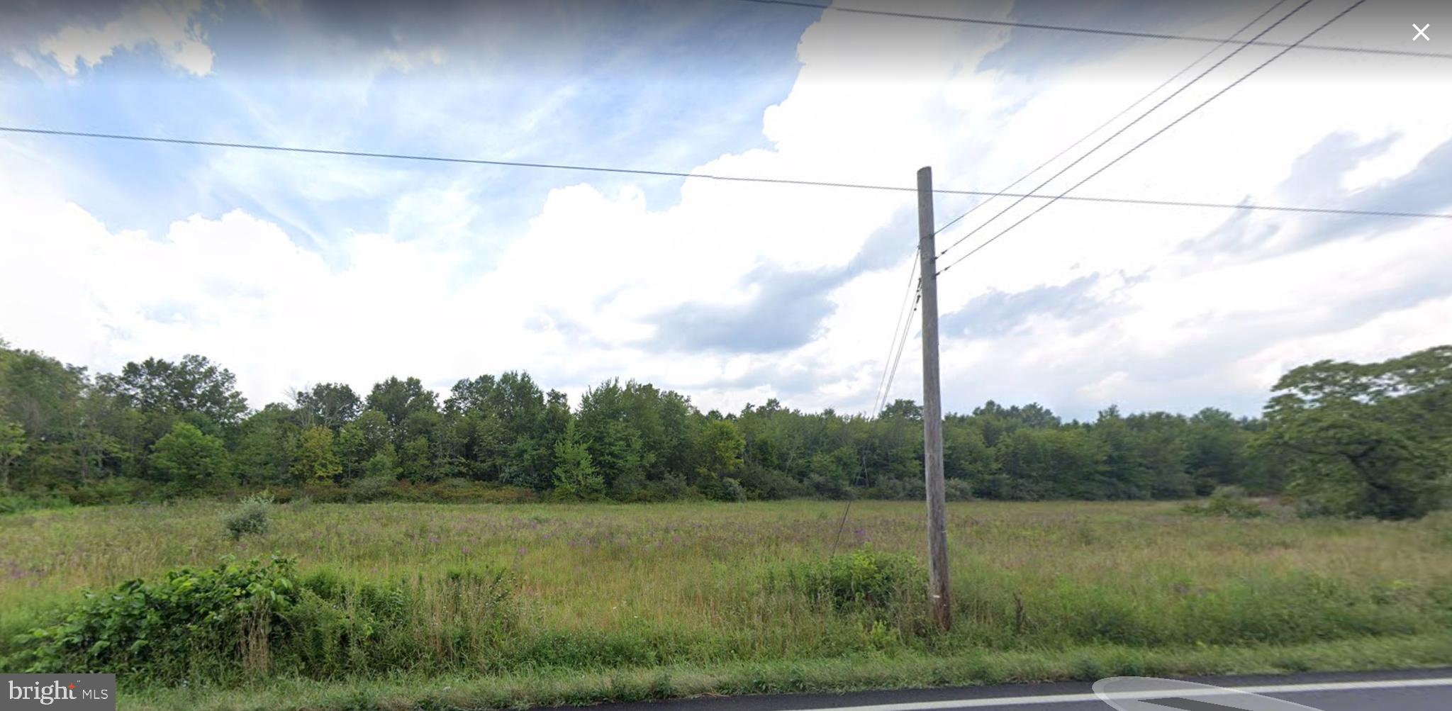 5403 Stump Road Pipersville, PA 18947 - Photo 4 of 6 a view of a green field with a fence