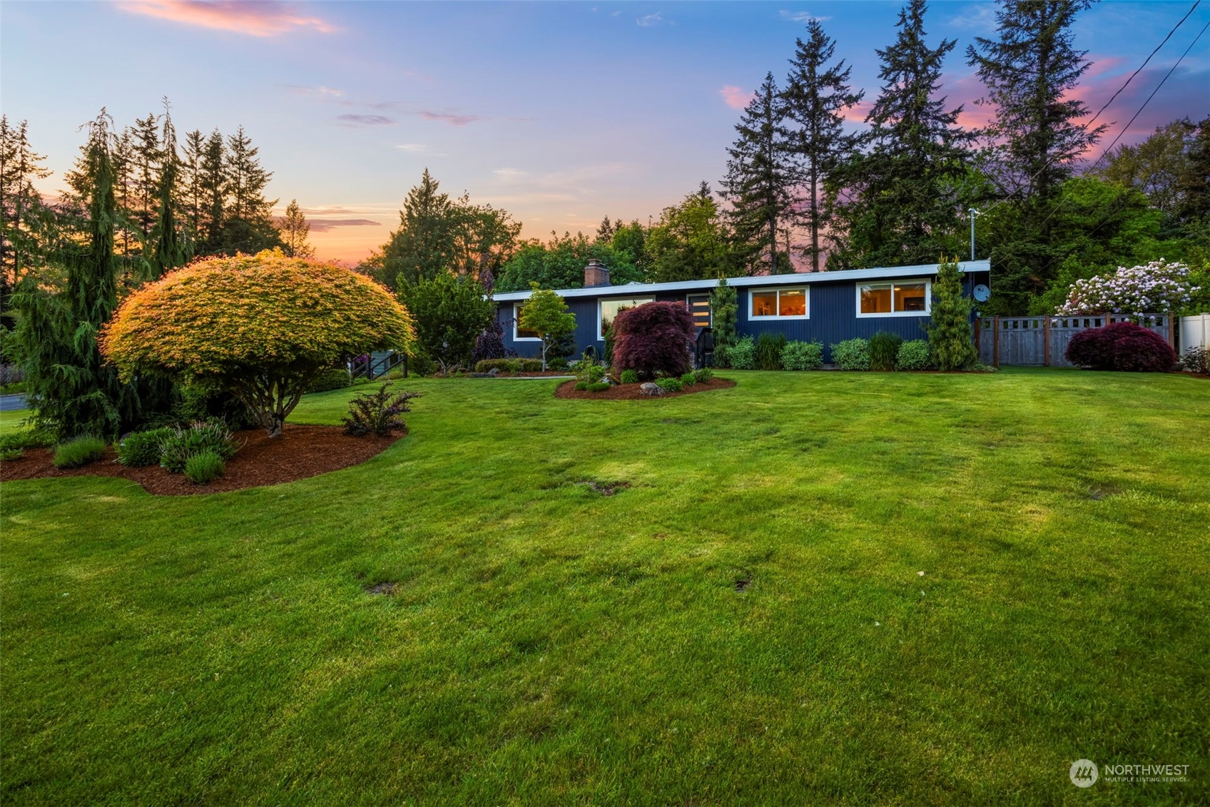 17828 Southeast 137th Street Renton, WA 98059 - Photo 1 of 1 a view of a garden with a house in the background
