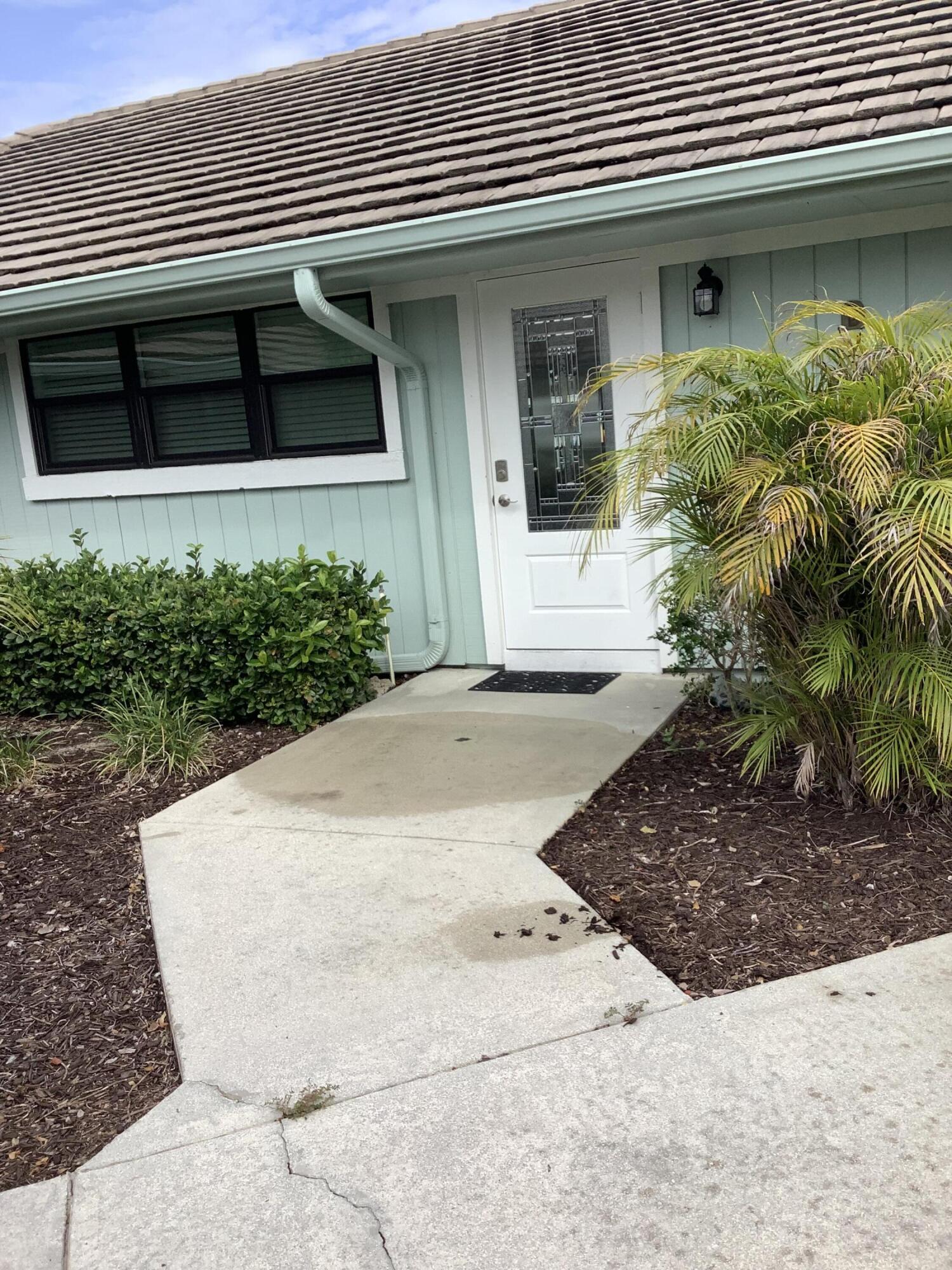 1127 East Seminole Avenue, Unit 11B Jupiter, FL 33477 - Photo 2 of 33 Front door