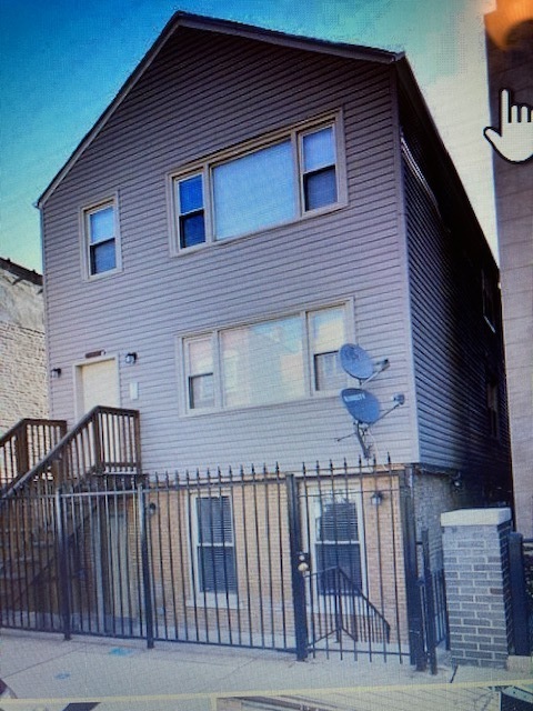 1223 North Cleaver Street, Unit 2 Chicago, IL 60642 - Photo 1 of 7 a view of a house with wooden deck