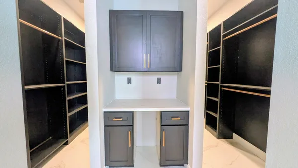 a kitchen with a refrigerator and cabinets
