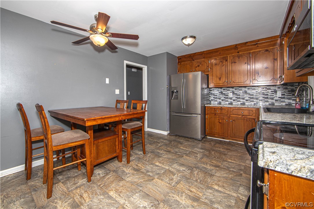 15909 Sandwave Road Chester, VA 23831 - Photo 14 of 20 a kitchen with a table and chairs