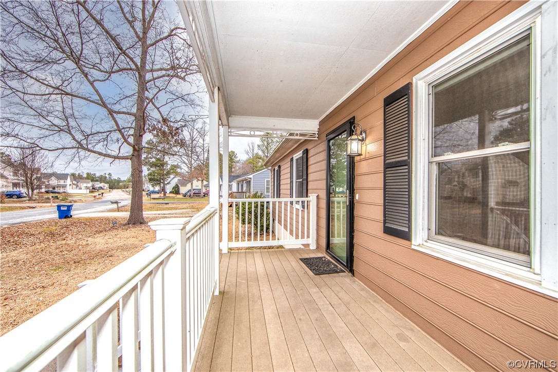 15909 Sandwave Road Chester, VA 23831 - Photo 2 of 20 a view of a street with a large tree