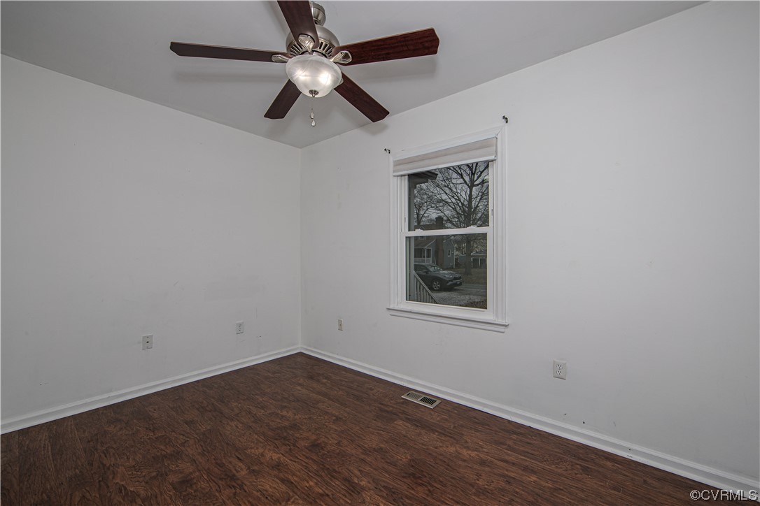 15909 Sandwave Road Chester, VA 23831 - Photo 8 of 20 an empty room with wooden floor ceiling fan and window