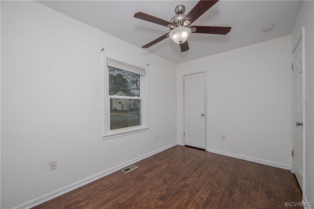 15909 Sandwave Road Chester, VA 23831 - Photo 9 of 20 an empty room with a window and a fan