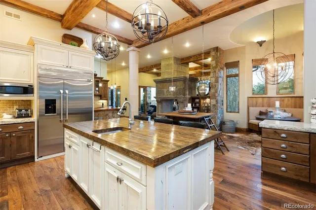 a large kitchen with stainless steel appliances granite countertop a large counter top and stove