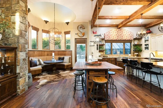 a view of a patio with table and chairs