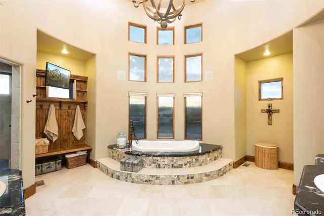 a view of a lobby with a mirror and a bath tub