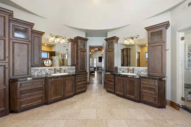 a large kitchen with cabinets and stainless steel appliances