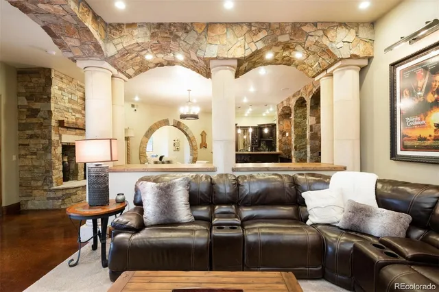a living room with a couch and a chandelier